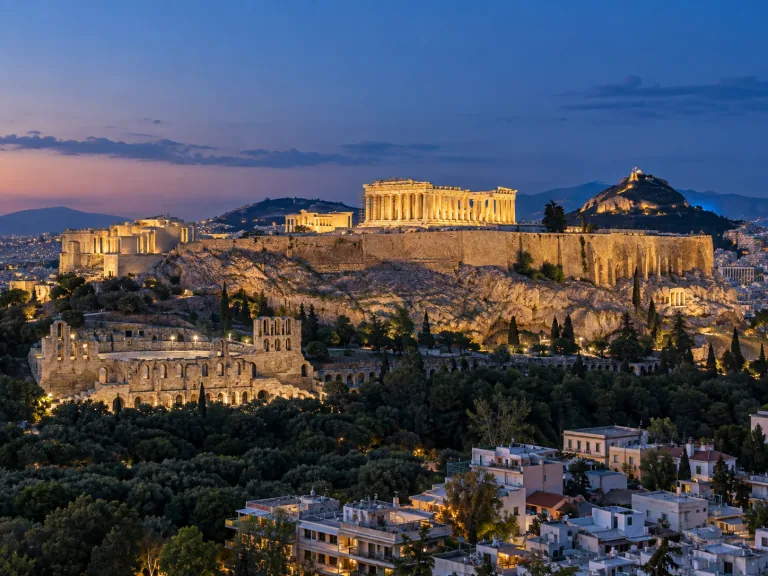Illuminated Acropolis above Athens at blue hour