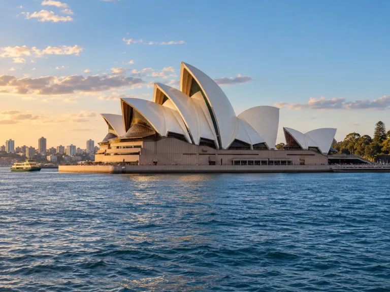 Sydney Opera House across the harbour in late afternoon light